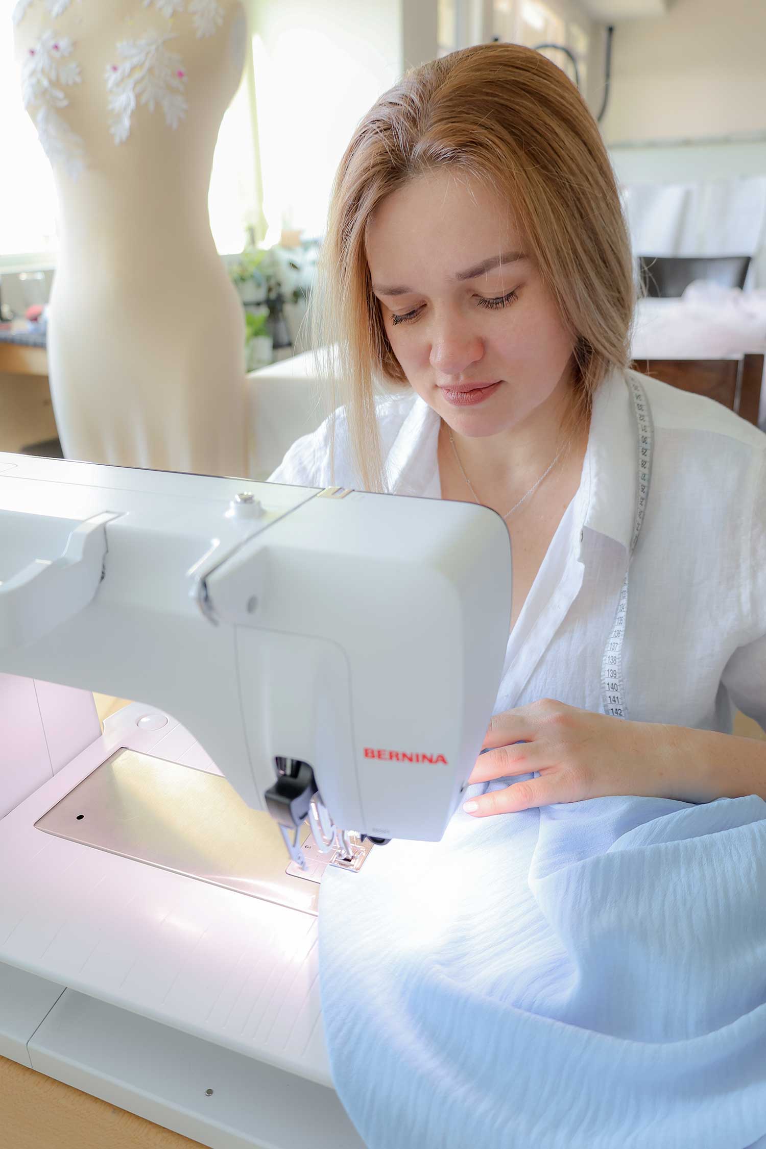 Levirina Iryna sewing at machine